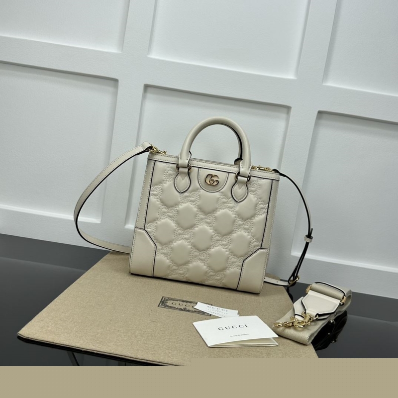 G*u*i top handle bags